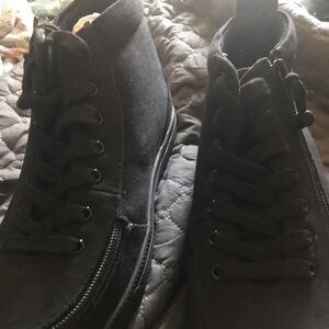 All black high top lace up or zip-up sneakers. Brand new with tags&box.